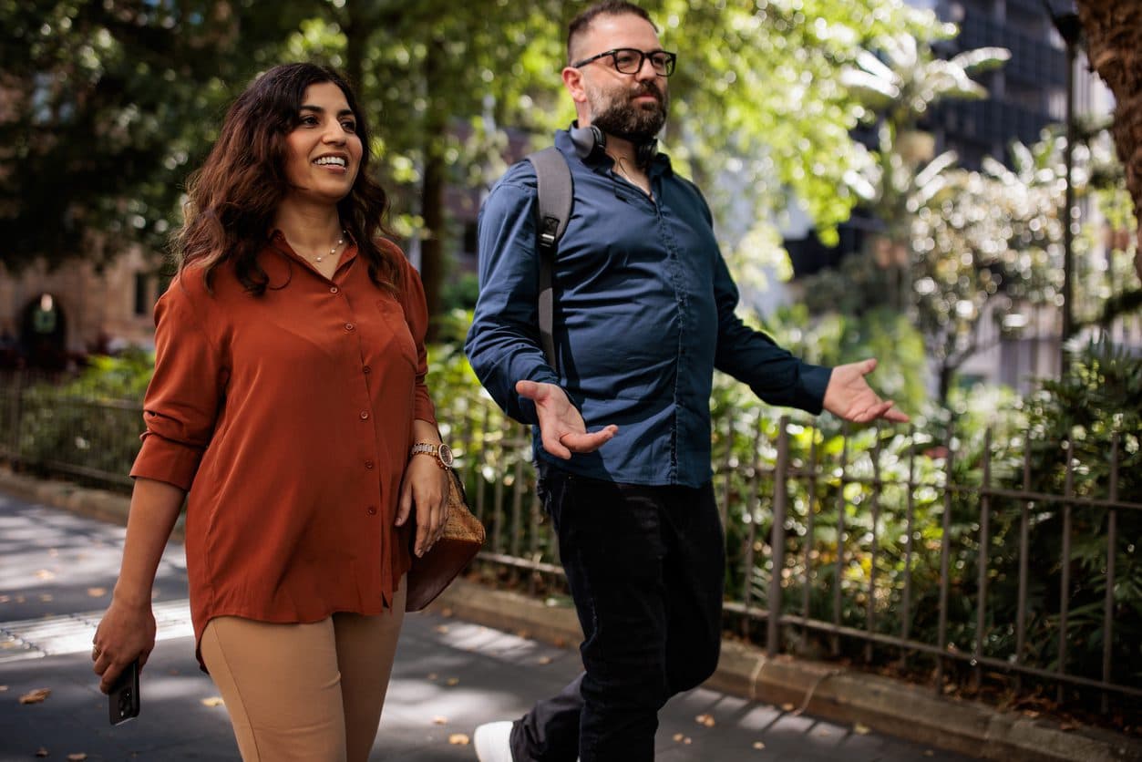 Two friends walking together in the park