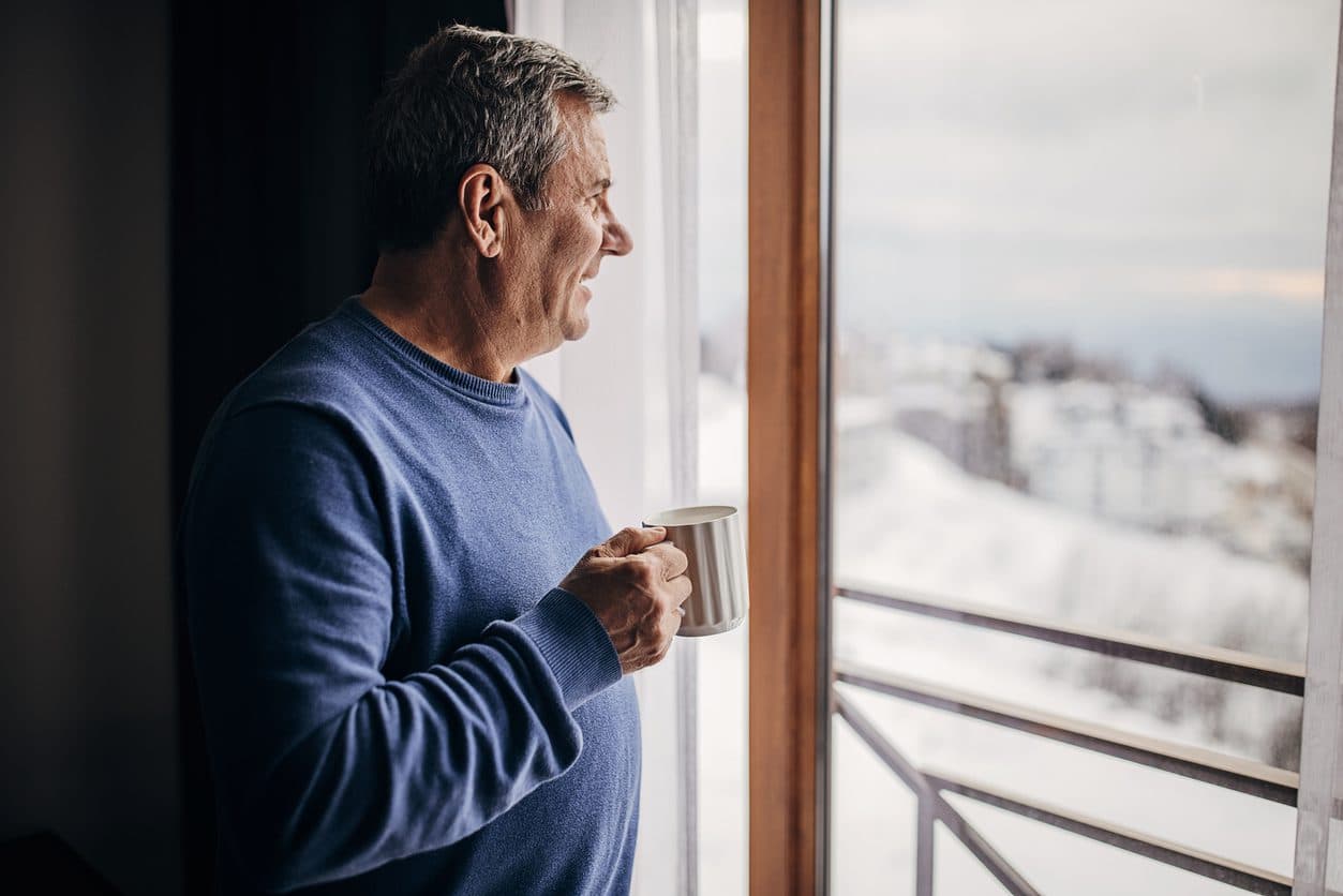 Man reflecting peacefully on his weight loss journey