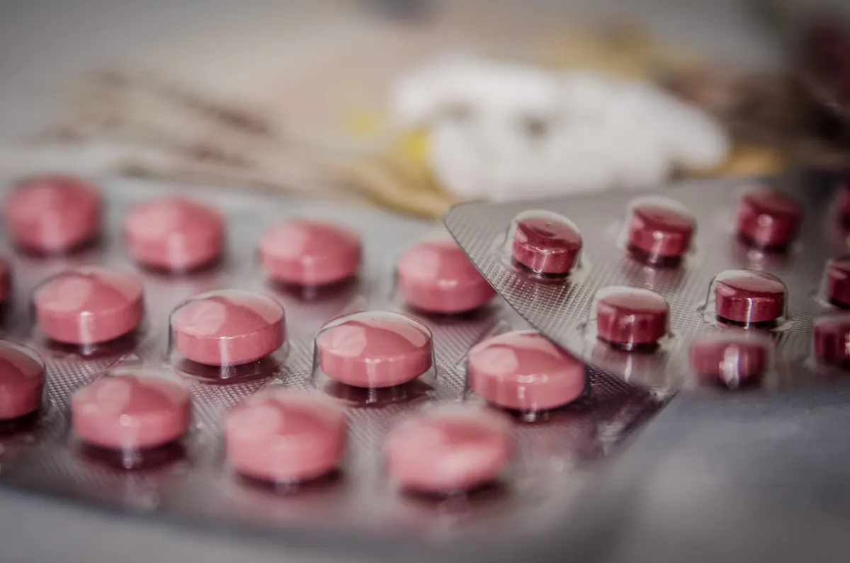 Blister packs of tablets on a table, close up.