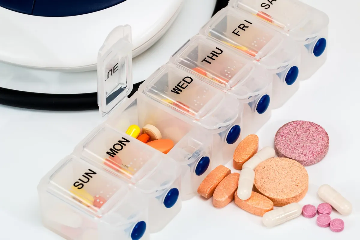 A weekly pill organiser labelled with days of the week.